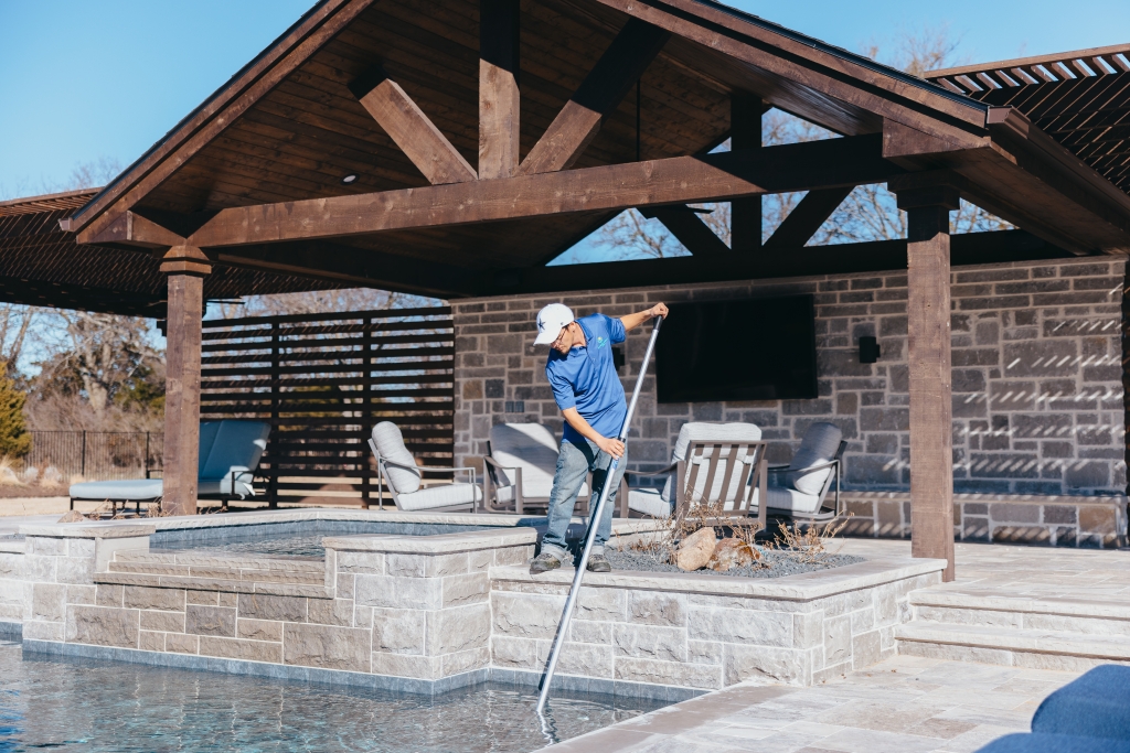 Riverbend Sandler technician cleaning pool