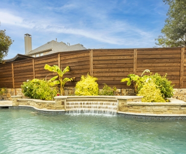 Natural staycation pool with waterfall.