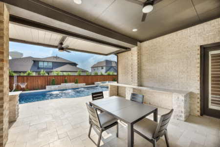 White stone outdoor kitchen and fan