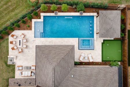 Aerial view of an outdoor entertainment area with pool