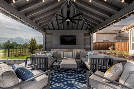 Outdoor sitting area and a TV