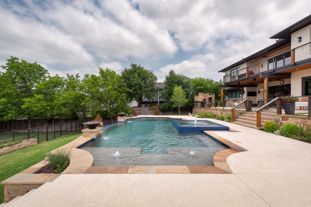 freeform pool with water fountain