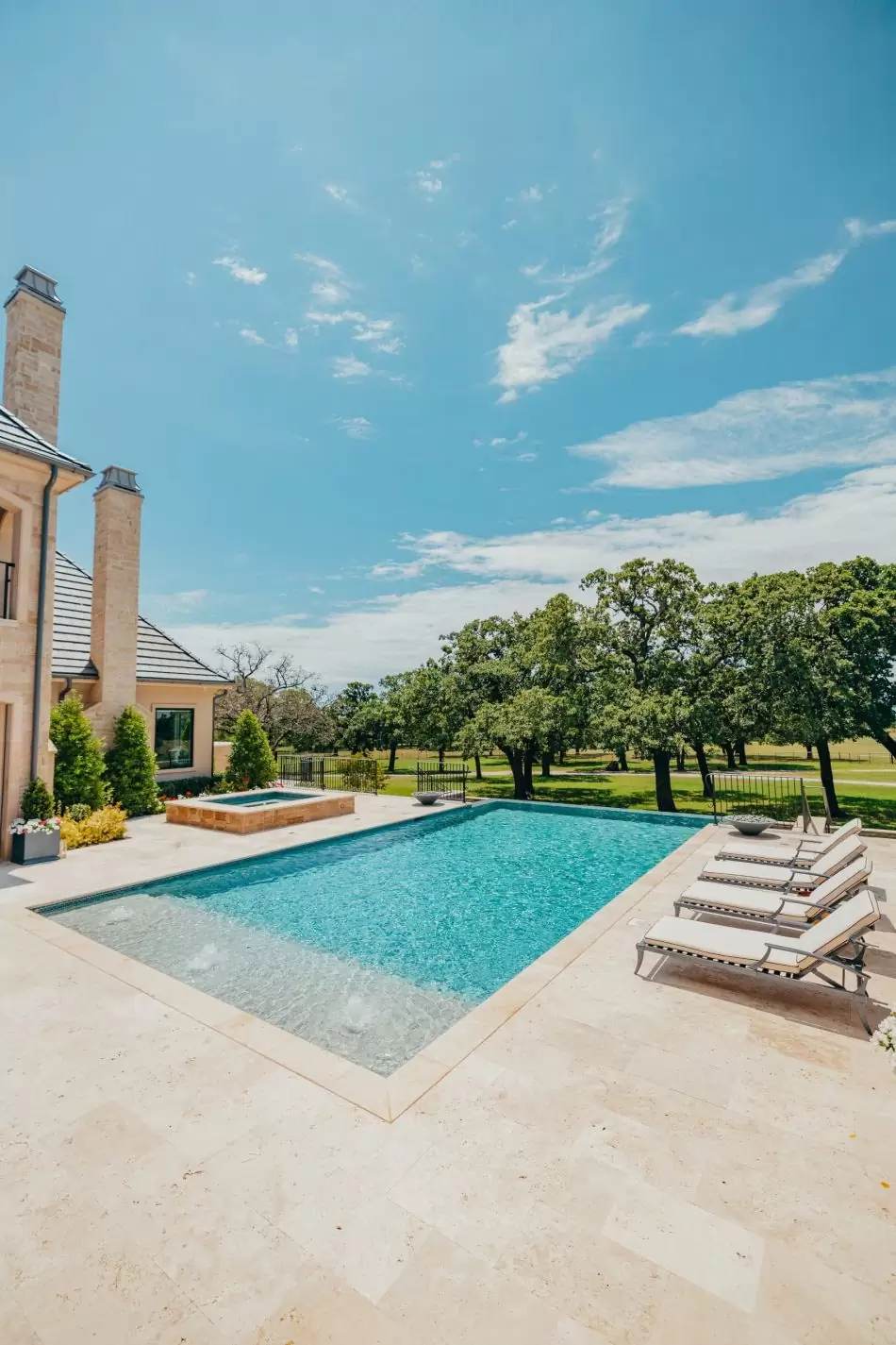 Pool on a sunny day with chairs