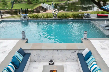 Sitting area with fire pit near an outdoor pool