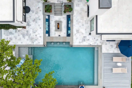 Aerial view of an outdoor pool and sitting area