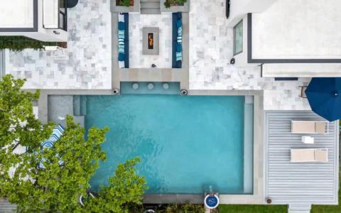 Aerial view of an outdoor pool and sitting area