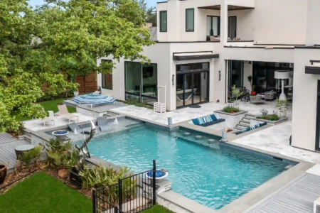 High view of an outdoor pool and firepit