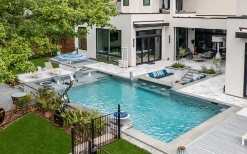 High view of an outdoor pool and firepit