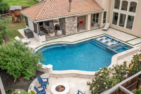 Aerial view of sitting area and pool near a firepit