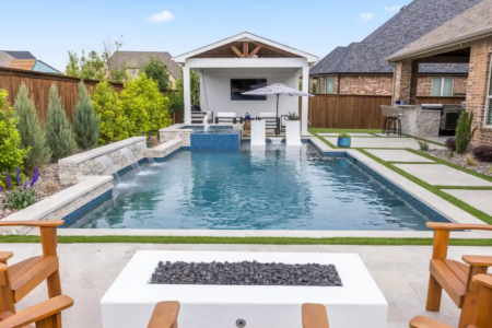 Close up of a firepit chairs near a swimming pool
