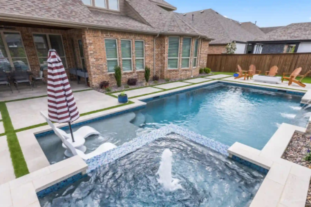 swim chairs and a fountain in a pool