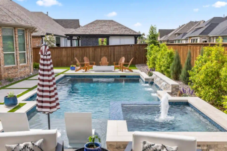Fountain and chairs near a pool