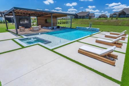 Relaxing chairs near a swimming pool