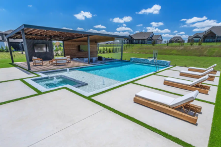 Relaxing chairs near a swimming pool