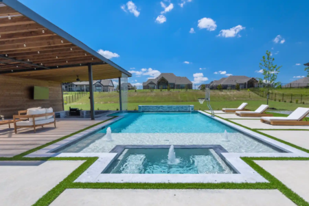 Outdoor fountains edging a pool