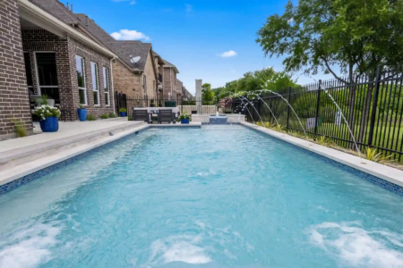 Sprayers pouring into a pool from the sides