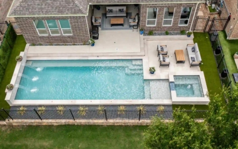Aerial view of an outdoor pool and sitting space